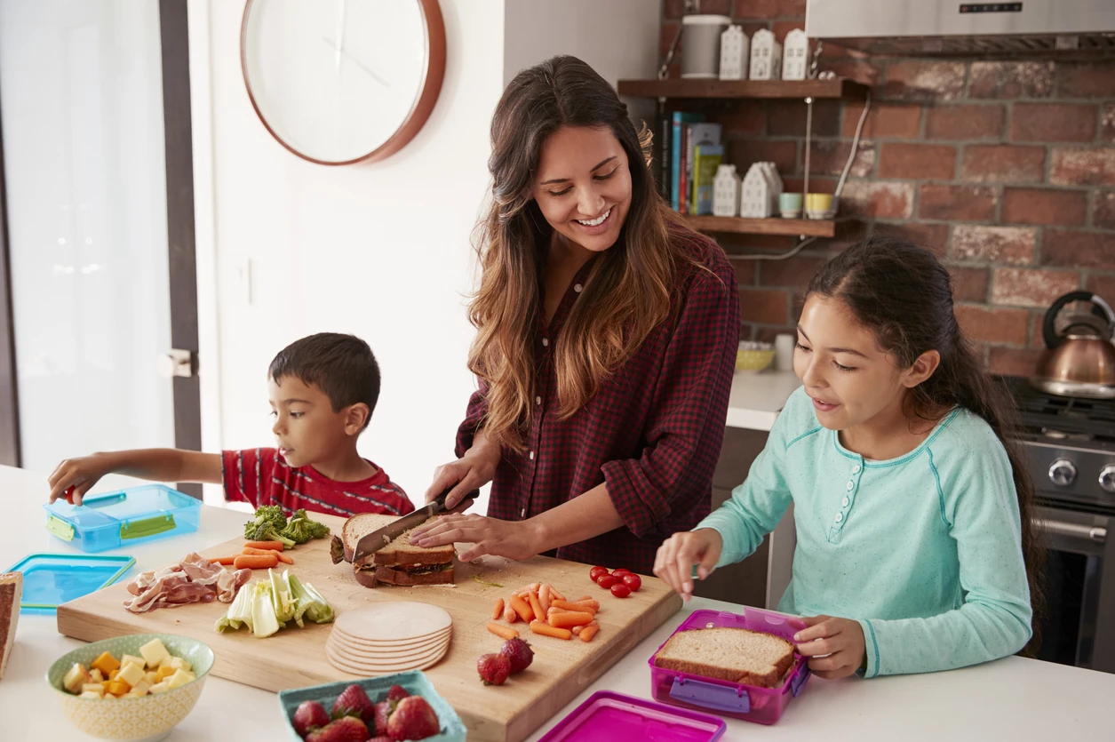 Mom making lunch with her kids.