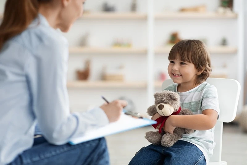 kid talking to therapist.